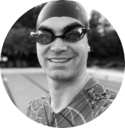 Man wearing swim cap and smart swim goggles